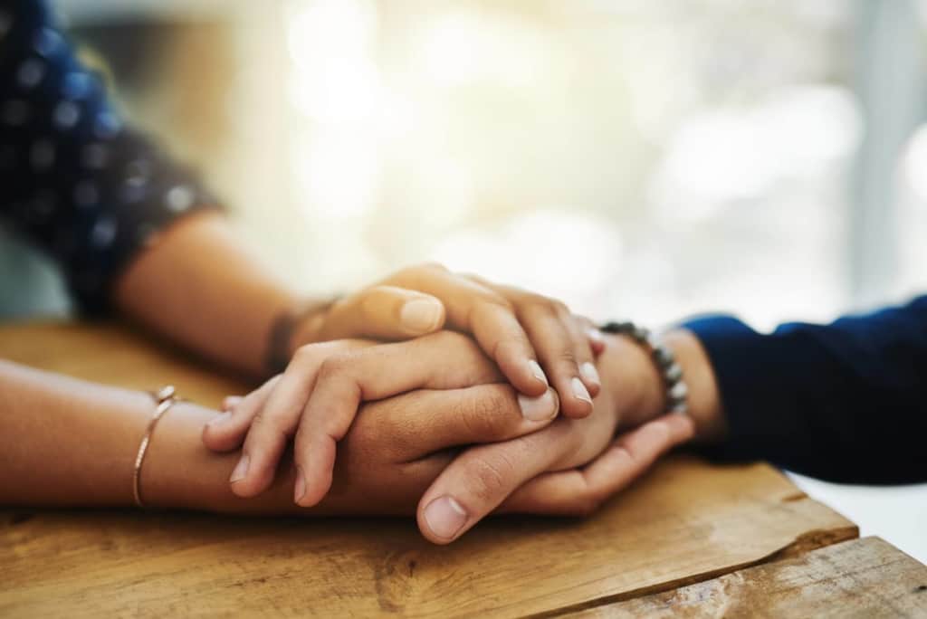 Holding a hand for support through withdrawal