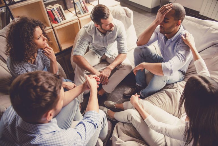 group of young adults in a sober living home