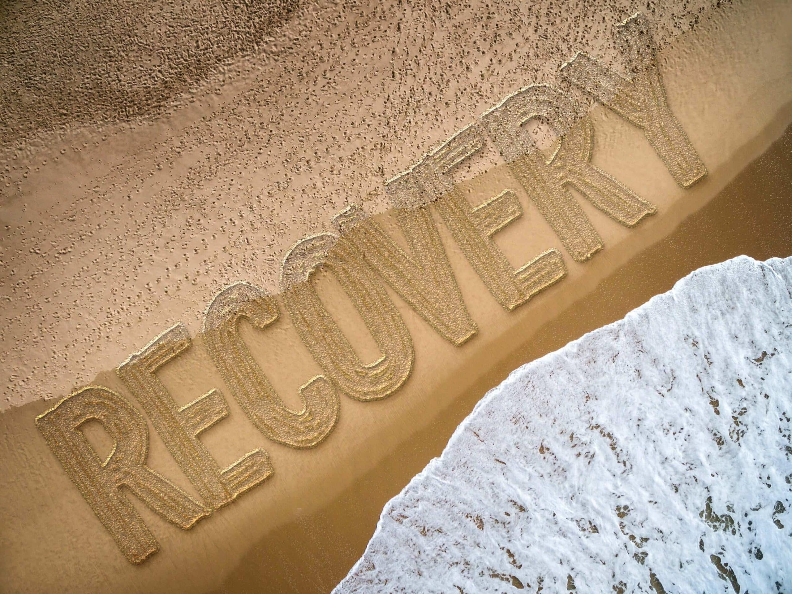 recovery written out next to the ocean